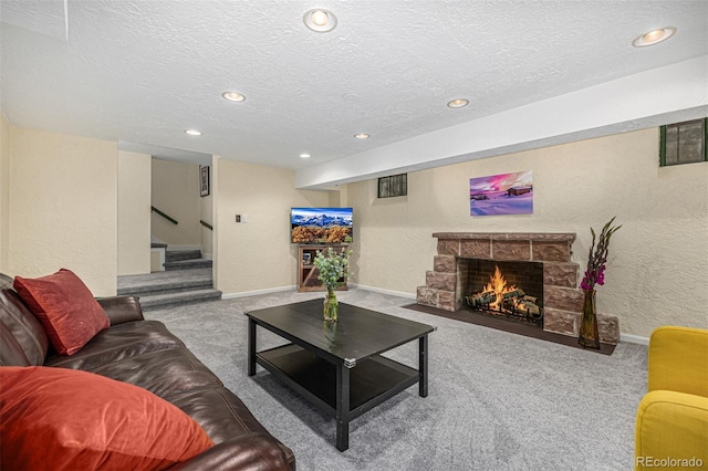 1795 N Monaco St Parkway, Denver, CO 80224 - living area featuring carpet, a textured ceiling, recessed lighting, a stone fireplace, and stairs