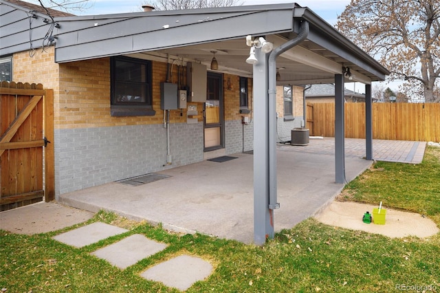 view of patio / terrace featuring central AC and fence