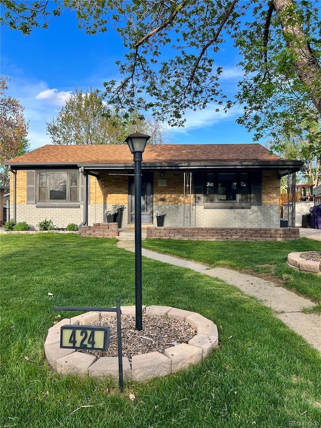 424 S Leyden St, Denver, CO 80224 - ranch-style home featuring brick siding and a front yard