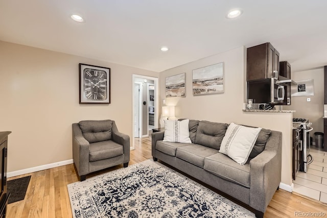 424 S Leyden St, Denver, CO 80224 - living area featuring light wood-style flooring, baseboards, and recessed lighting