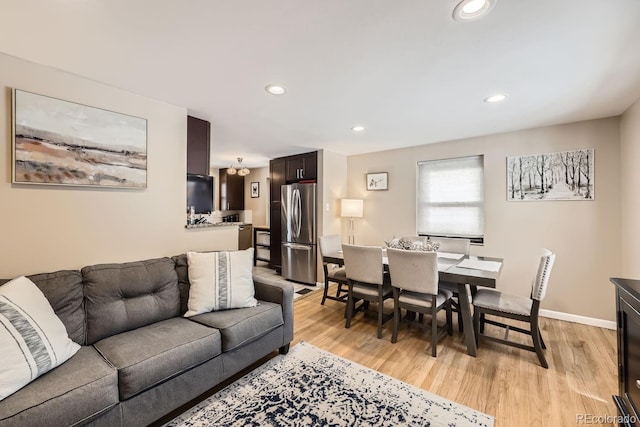 424 S Leyden St, Denver, CO 80224 - living room with recessed lighting, light wood-style flooring, and baseboards