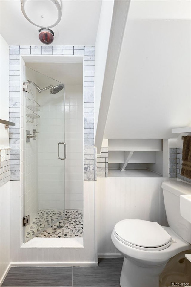 424 S Leyden St, Denver, CO 80224 - bathroom featuring a shower stall, toilet, and wood finished floors