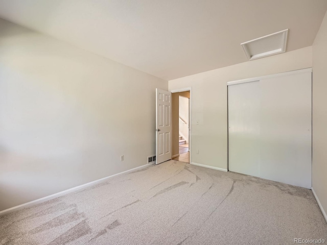 13598 E Asbury Dr, Aurora, CO 80014 - unfurnished bedroom featuring light colored carpet, baseboards, and a closet