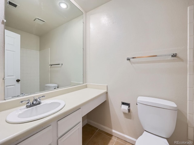 13598 E Asbury Dr, Aurora, CO 80014 - bathroom featuring toilet, tile patterned flooring, baseboards, and vanity