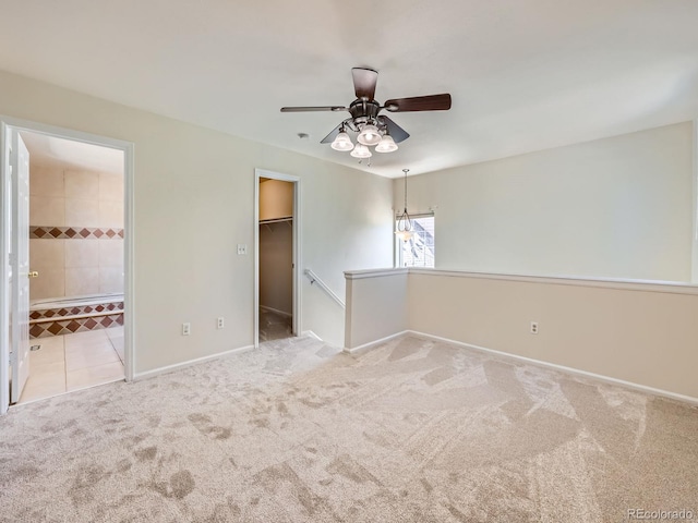 13598 E Asbury Dr, Aurora, CO 80014 - unfurnished bedroom with a walk in closet, carpet, connected bathroom, baseboards, and a closet