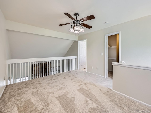 13598 E Asbury Dr, Aurora, CO 80014 - spare room with ceiling fan, carpet, baseboards, and lofted ceiling