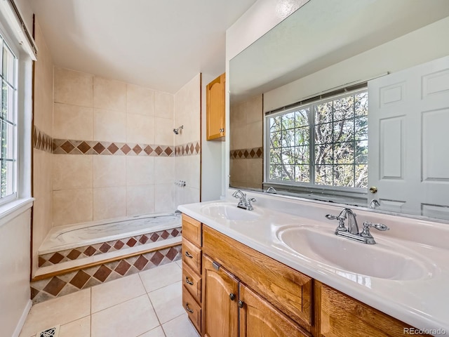 13598 E Asbury Dr, Aurora, CO 80014 - full bath with tile patterned floors, double vanity, and tiled shower / bath