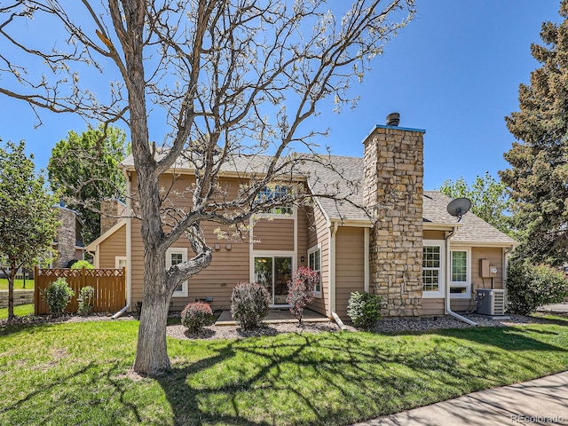 13598 E Asbury Dr, Aurora, CO 80014 - rear view of house with a chimney, roof with shingles, central AC, and a patio