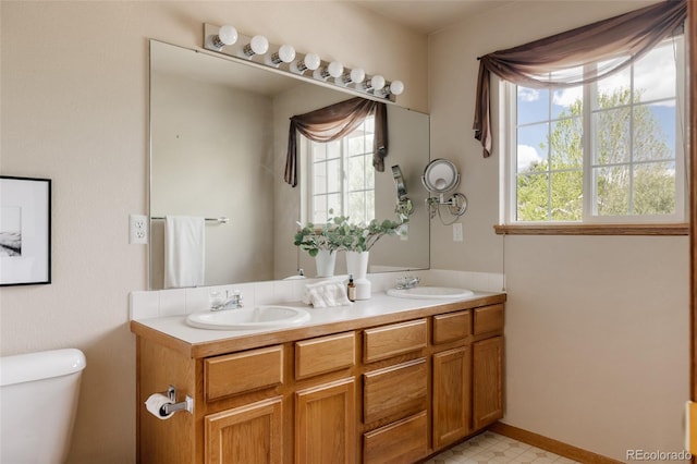 1157 Belleview Dr, Fort Collins, CO 80526 - full bathroom with toilet and double vanity