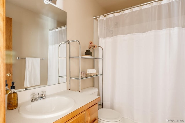 1157 Belleview Dr, Fort Collins, CO 80526 - full bathroom with toilet, vanity, and a shower with shower curtain