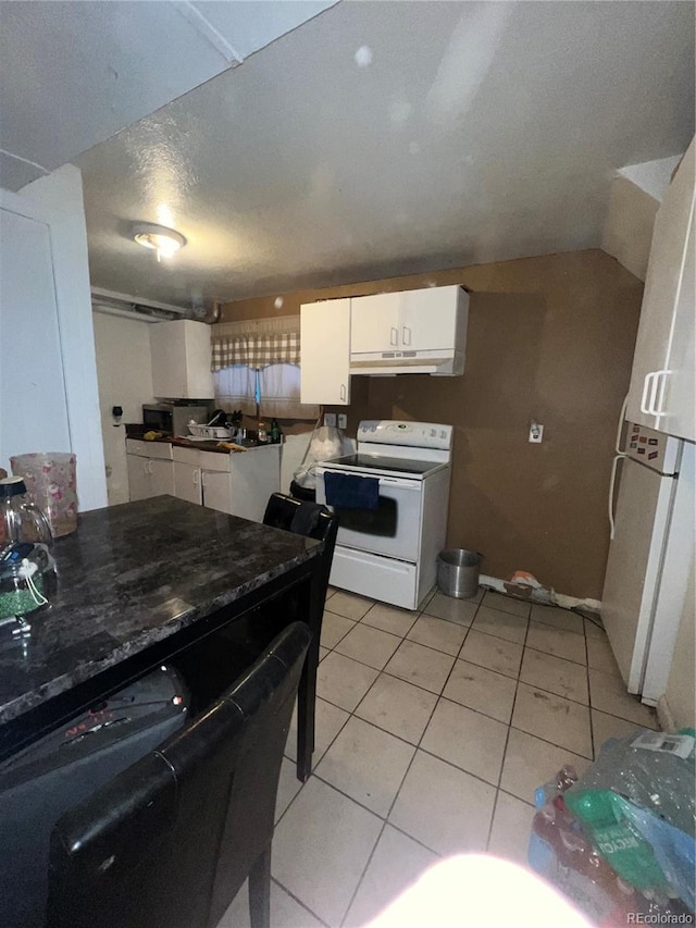 kitchen featuring sink, white cabinets, white appliances, and light tile patterned floors