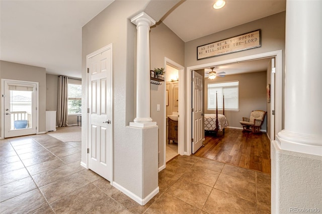 5550 Fox Meadow Ave, Highlands Ranch, CO 80130 - corridor with decorative columns, light tile patterned floors, and baseboards
