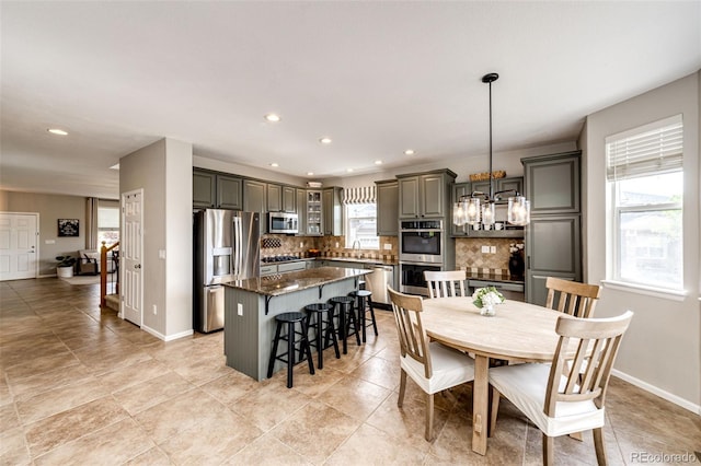 5550 Fox Meadow Ave, Highlands Ranch, CO 80130 - dining space with recessed lighting, a chandelier, and baseboards