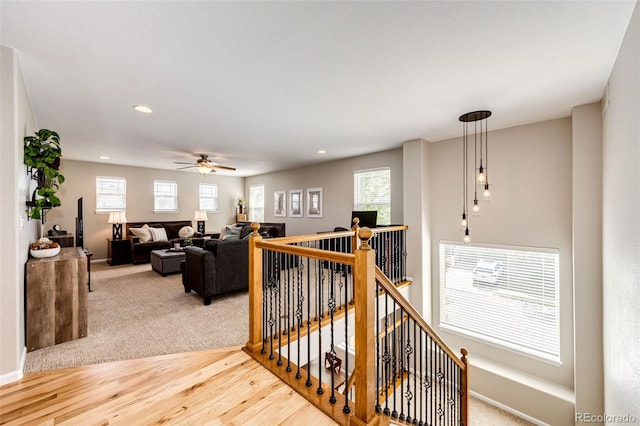 5550 Fox Meadow Ave, Highlands Ranch, CO 80130 - hall featuring an upstairs landing, recessed lighting, light wood-type flooring, and baseboards