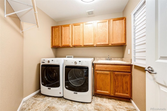 5550 Fox Meadow Ave, Highlands Ranch, CO 80130 - laundry area with cabinet space, washing machine and dryer, and baseboards