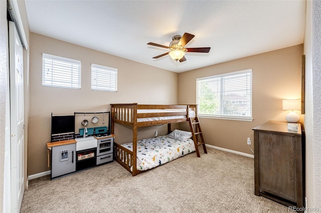 5550 Fox Meadow Ave, Highlands Ranch, CO 80130 - bedroom with light carpet, baseboards, ceiling fan, and a closet
