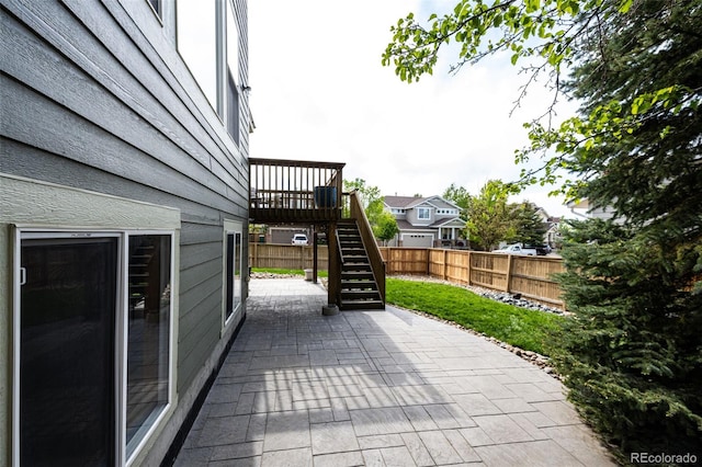 5550 Fox Meadow Ave, Highlands Ranch, CO 80130 - fenced backyard featuring a patio area, stairway, and a wooden deck