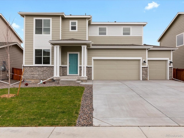 view of front of house with driveway, stone siding, a garage, and an attached garage