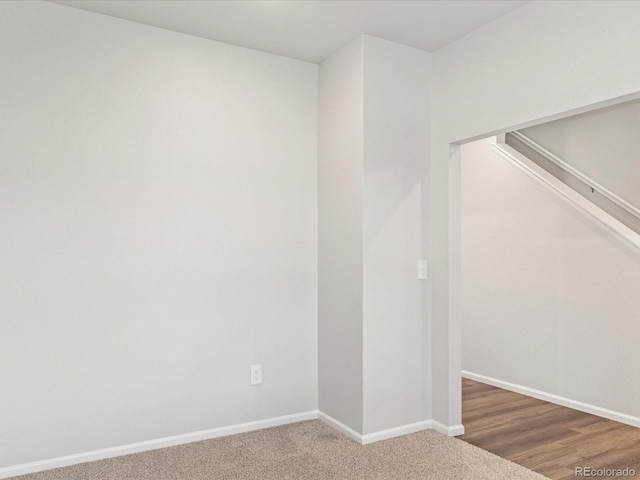 empty room featuring baseboards