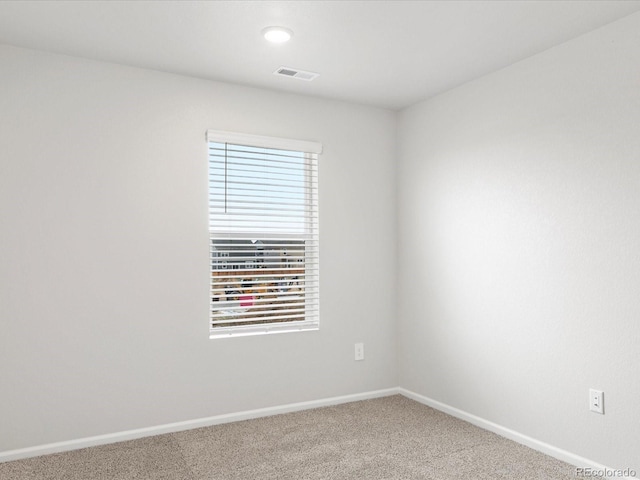 spare room with carpet floors, baseboards, and recessed lighting