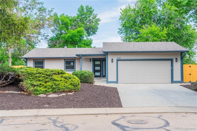 1248 Ilium Dr, Lafayette, CO 80026 - single story home featuring a garage and concrete driveway