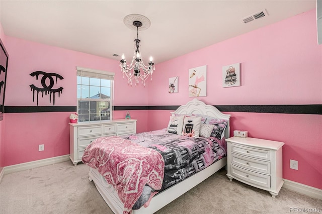 carpeted bedroom featuring a notable chandelier