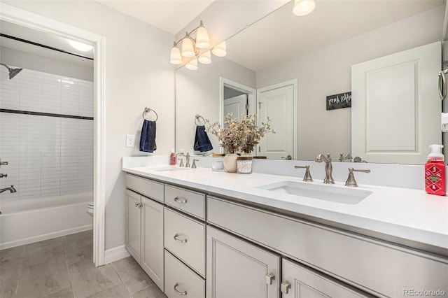 full bathroom featuring toilet, tile patterned flooring, tiled shower / bath combo, and vanity