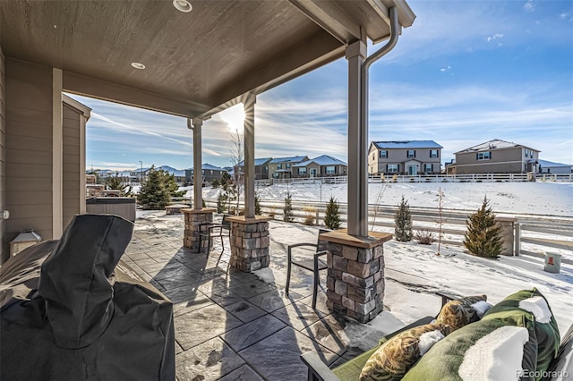 snow covered patio featuring area for grilling