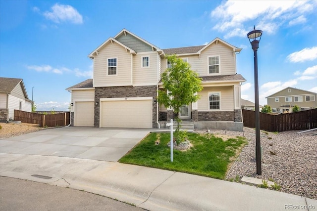 1711 Lazear St, Loveland, CO 80538 - craftsman-style home with concrete driveway, stone siding, and an attached garage