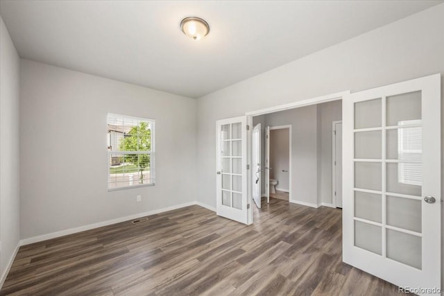 1711 Lazear St, Loveland, CO 80538 - unfurnished room with french doors, wood finished floors, and baseboards