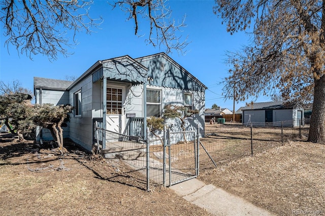 view of front of house with fence and a gate