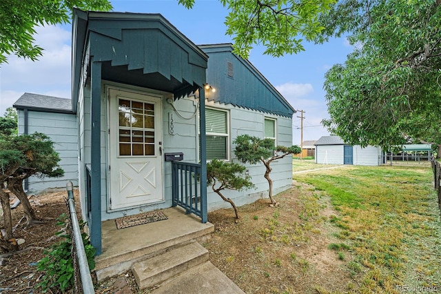 1200 Newark St, Aurora, CO 80010 - doorway to property featuring a lawn