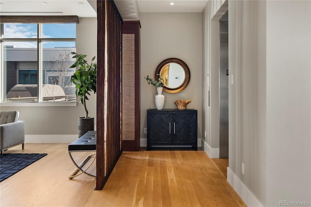 entryway with light hardwood / wood-style floors