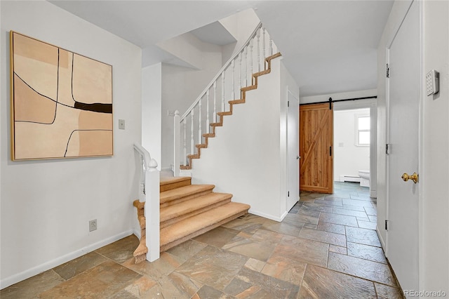 7076 S Spruce Dr W, Centennial, CO 80112 - stairway with stone tile floors, baseboards, a baseboard heating unit, and a barn door