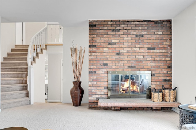 7076 S Spruce Dr W, Centennial, CO 80112 - carpeted living room featuring stairway and a brick fireplace