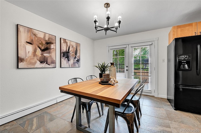 7076 S Spruce Dr W, Centennial, CO 80112 - dining space with a baseboard heating unit, stone tile floors, a chandelier, and baseboards