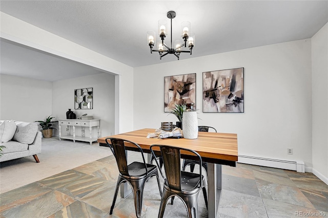 7076 S Spruce Dr W, Centennial, CO 80112 - dining room featuring a baseboard heating unit, a chandelier, stone finish flooring, and baseboards