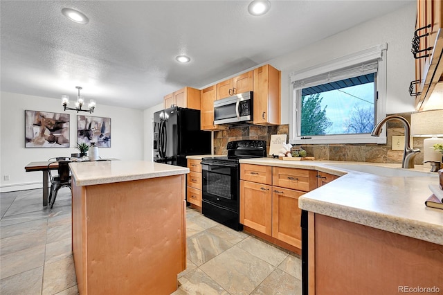 7076 S Spruce Dr W, Centennial, CO 80112 - kitchen with black appliances, a sink, a kitchen island, tasteful backsplash, and a chandelier