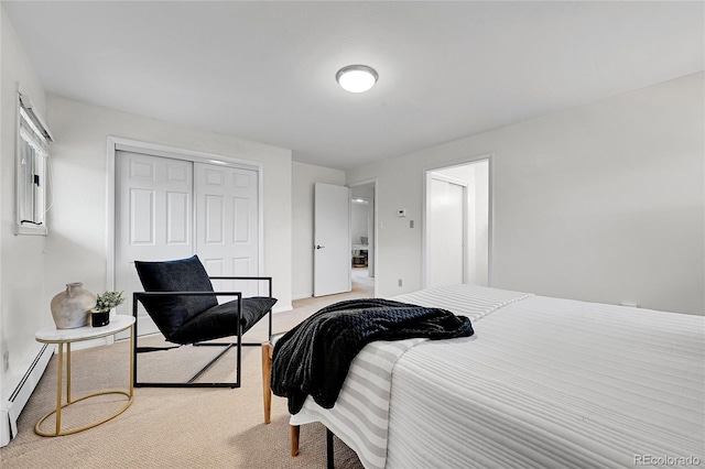 7076 S Spruce Dr W, Centennial, CO 80112 - bedroom with a closet, a baseboard radiator, and carpet floors