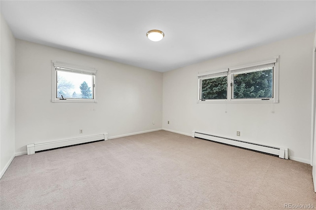 7076 S Spruce Dr W, Centennial, CO 80112 - unfurnished room featuring a baseboard heating unit, a baseboard radiator, carpet flooring, and baseboards