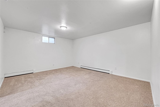 7076 S Spruce Dr W, Centennial, CO 80112 - carpeted empty room featuring a baseboard heating unit and baseboards