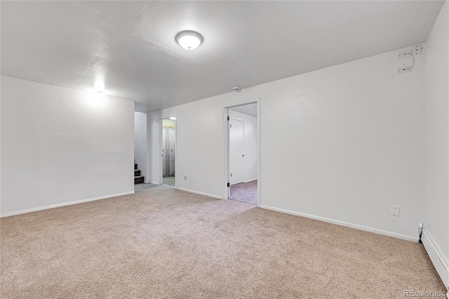 7076 S Spruce Dr W, Centennial, CO 80112 - spare room with light colored carpet, stairs, baseboard heating, and baseboards