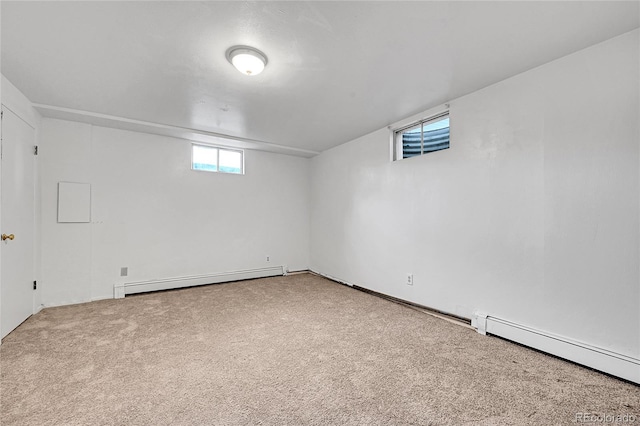 7076 S Spruce Dr W, Centennial, CO 80112 - basement featuring a baseboard heating unit and carpet flooring