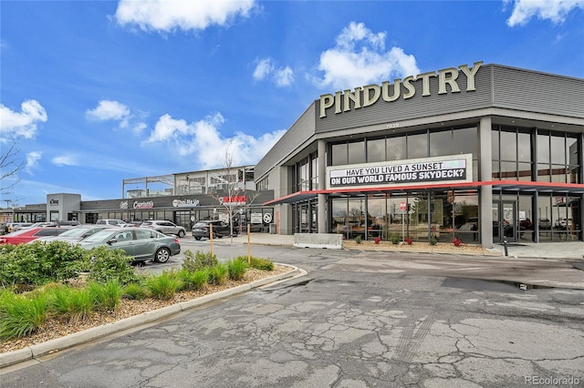 7076 S Spruce Dr W, Centennial, CO 80112 - view of commercial property featuring uncovered parking
