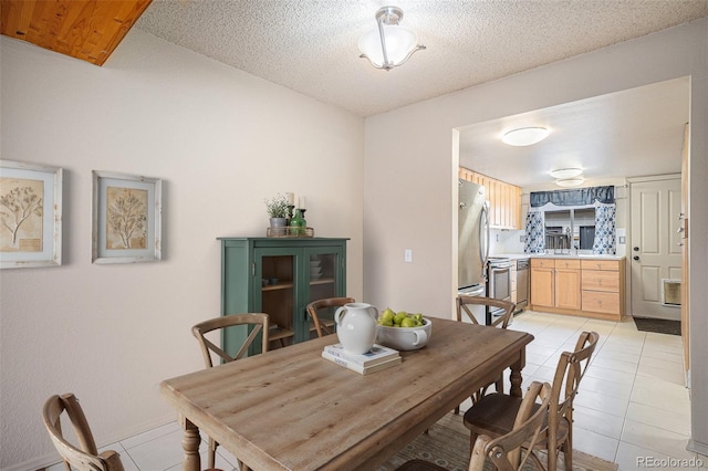 3593 S Kittredge St Unit E, Aurora, CO 80013 - dining area featuring light tile patterned floors