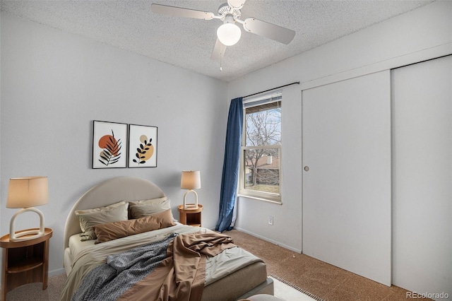 3593 S Kittredge St Unit E, Aurora, CO 80013 - bedroom featuring carpet, a textured ceiling, ceiling fan, and a closet