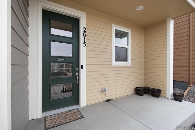 property entrance featuring a porch