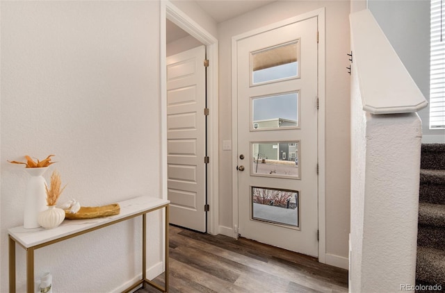 entryway with hardwood / wood-style flooring