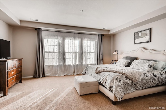 bedroom with carpet floors and visible vents
