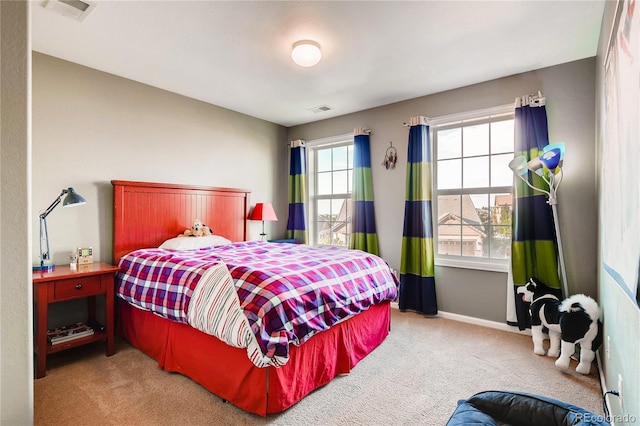 bedroom with carpet flooring, baseboards, and visible vents
